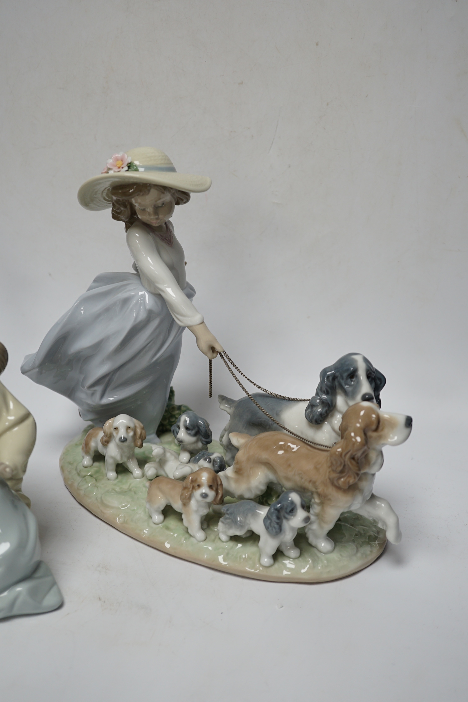 A large Lladro figure group “La gran familia, Puppy Brigade”, Baby Jesus, Duckling, New Friend, Chit-Chat, Sunday’s Child, Little Sister, Cat and Mouse and heavenly Tenor (9), largest 30 cm wide